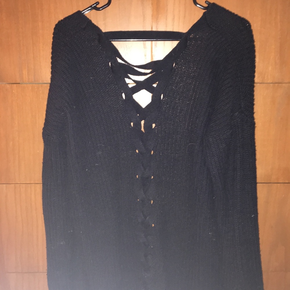 Black sweater with corset back.